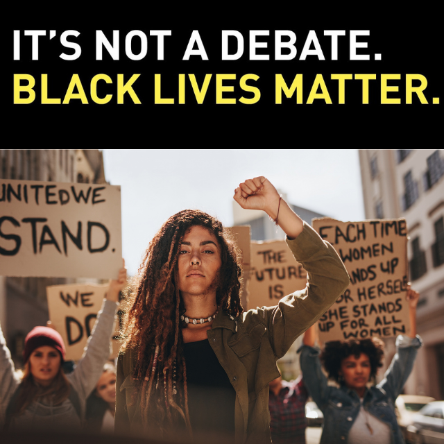 The words "It's not a debate. Black Lives Matter." are shown above an image of a group of people holding signs and fists raised in the air, marching down a city street.