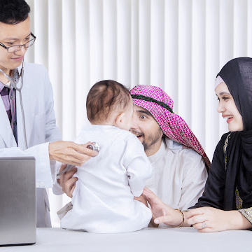 A family with an infant child consults with a doctor.